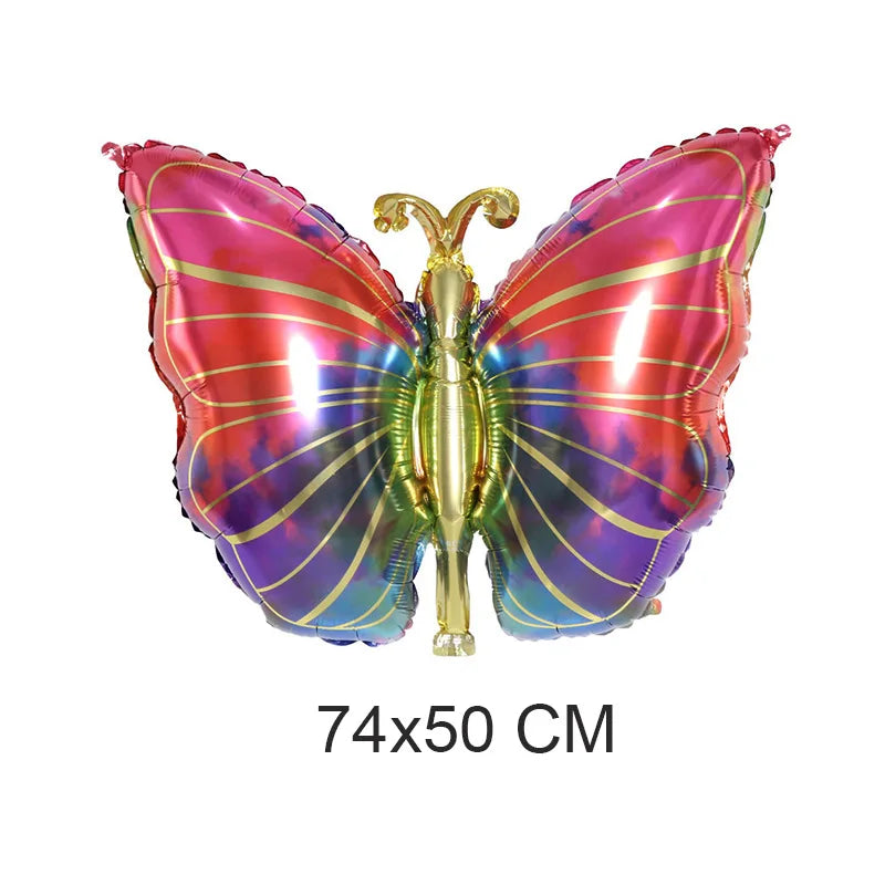 Colorful butterfly-shaped balloon with gold accents on a white background