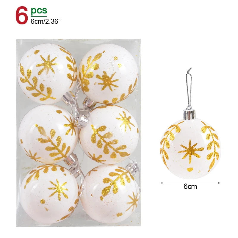 Set of six white Christmas ornaments with gold snowflake patterns in packaging