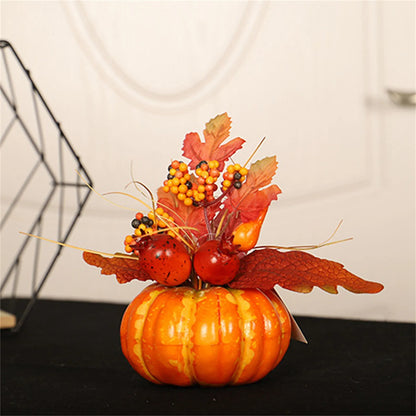 Decorative pumpkin with autumn leaves and berries on a black surface.