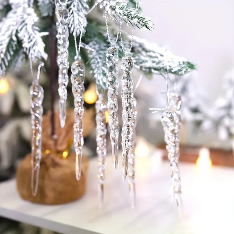 Decorative icicle ornaments hanging on a Christmas tree with blurred lights in the background.