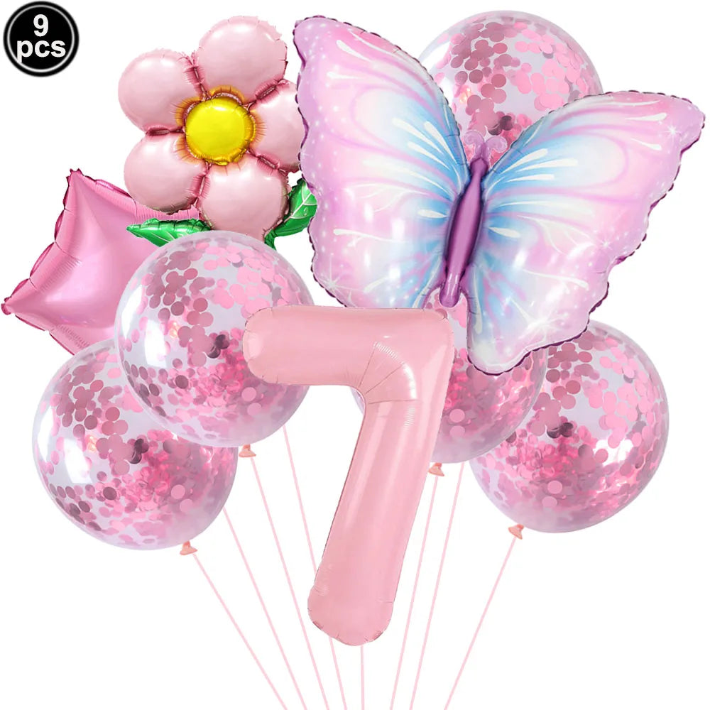 Set of pink balloons including a butterfly, flower, and number 7 on a white background