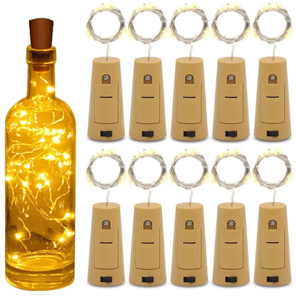 Set of LED wine bottle lights with a cork design, including a lit bottle and multiple light corks.