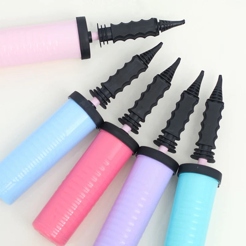 Colorful balloon inflation pumps with black nozzles on a white background