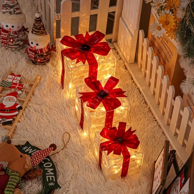 Decorative lights with red bows on a white surface, surrounded by Christmas-themed items.