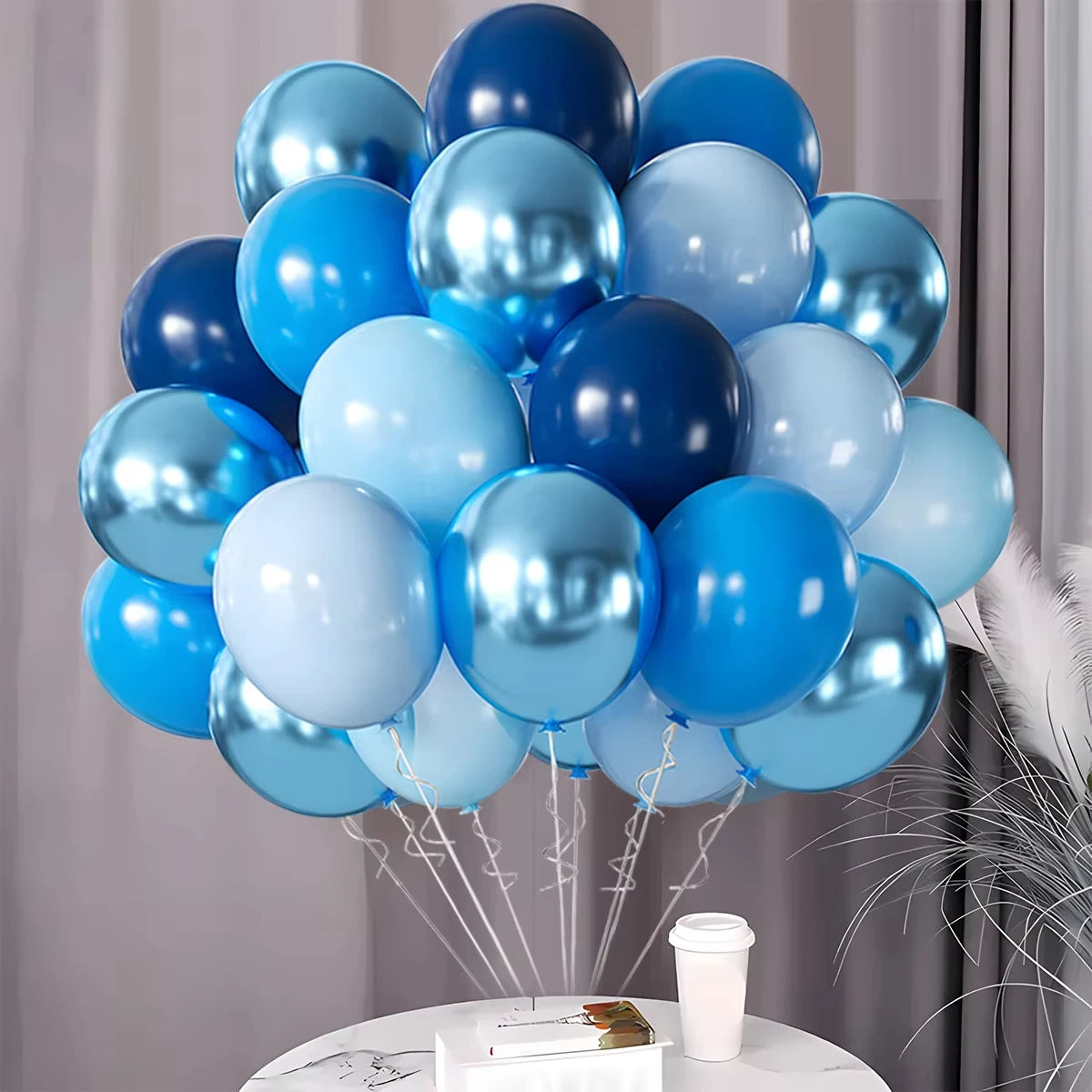 Bunch of blue balloons on a table with a neutral background