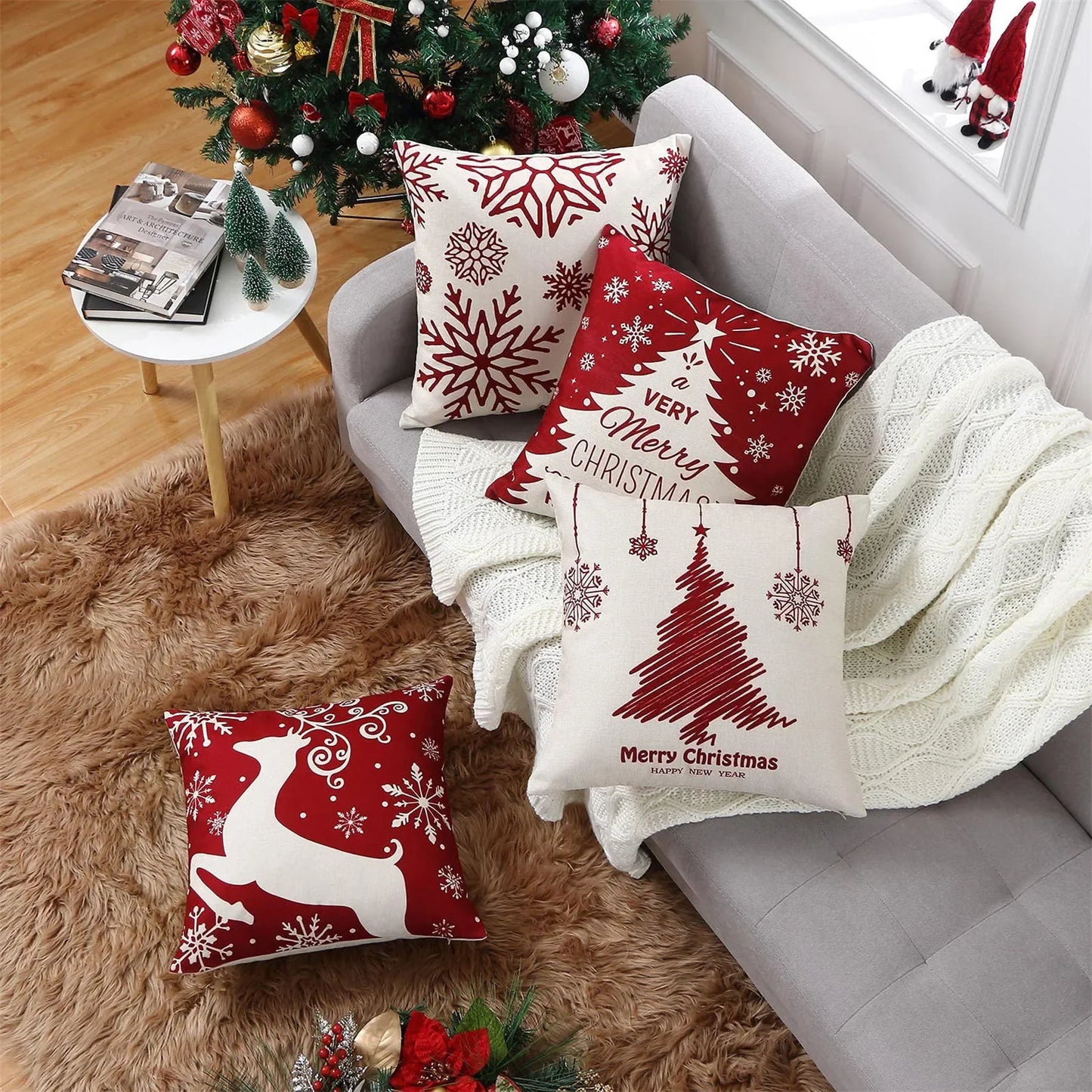 Decorative Christmas pillows on a sofa with a festive background
