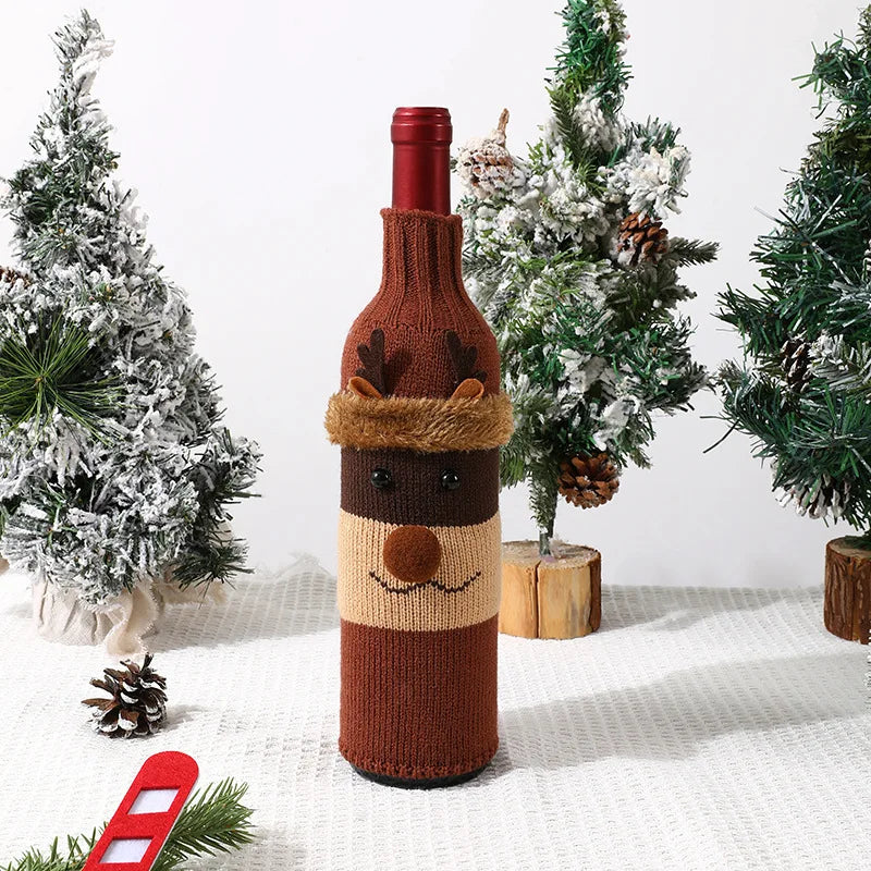 Knitted reindeer wine bottle cover with Christmas trees in the background