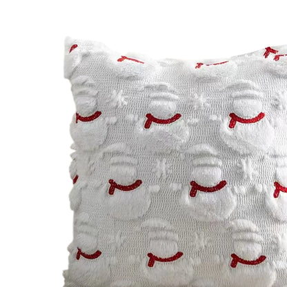 White pillow with red smiley face patterns on a white background