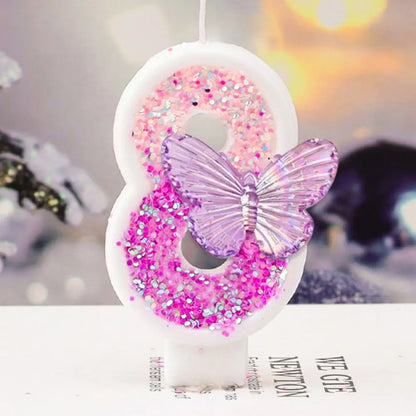 Decorative number '6' with a butterfly and pink glitter on a white background