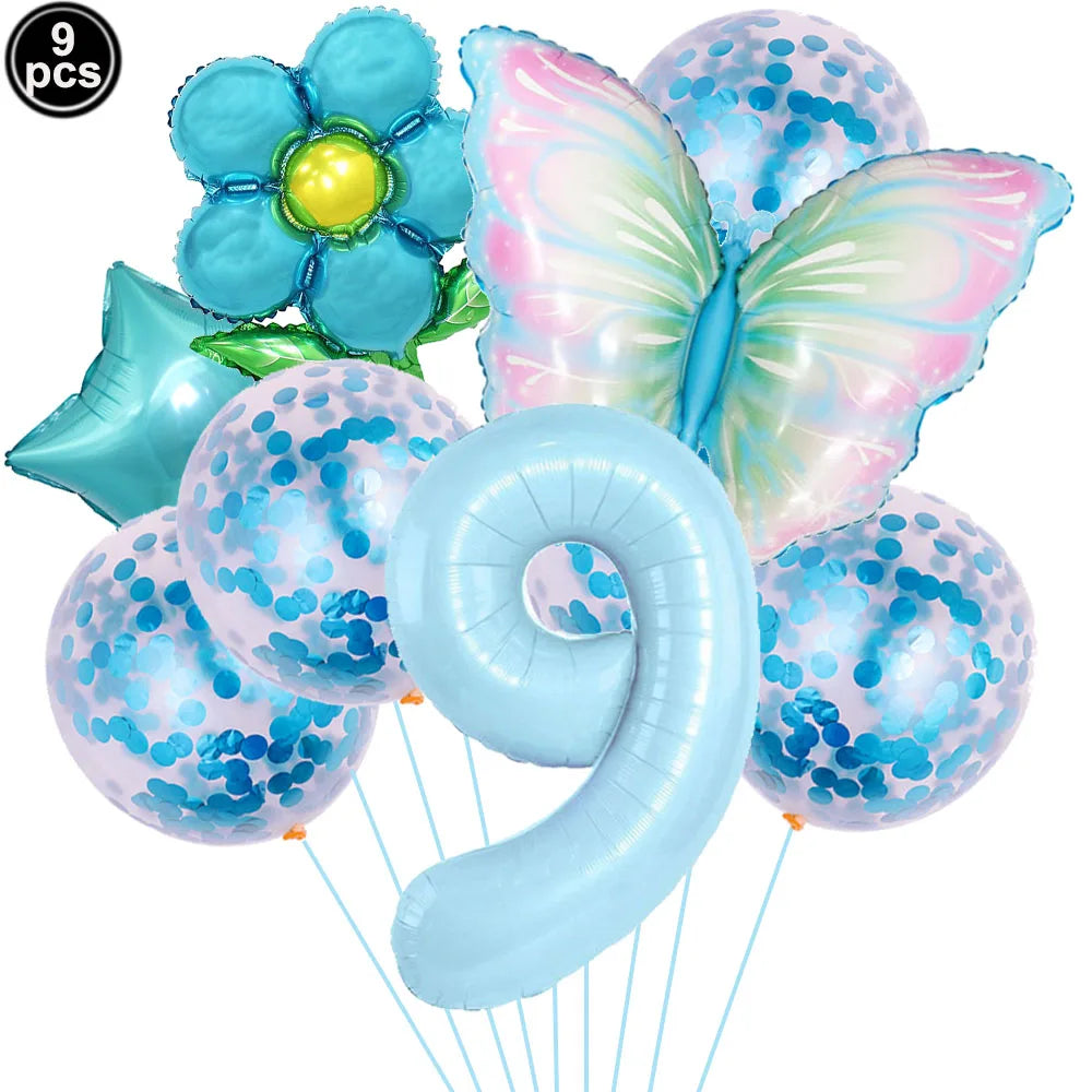 Set of colorful balloons including a butterfly, flower, and confetti shapes on a white background.