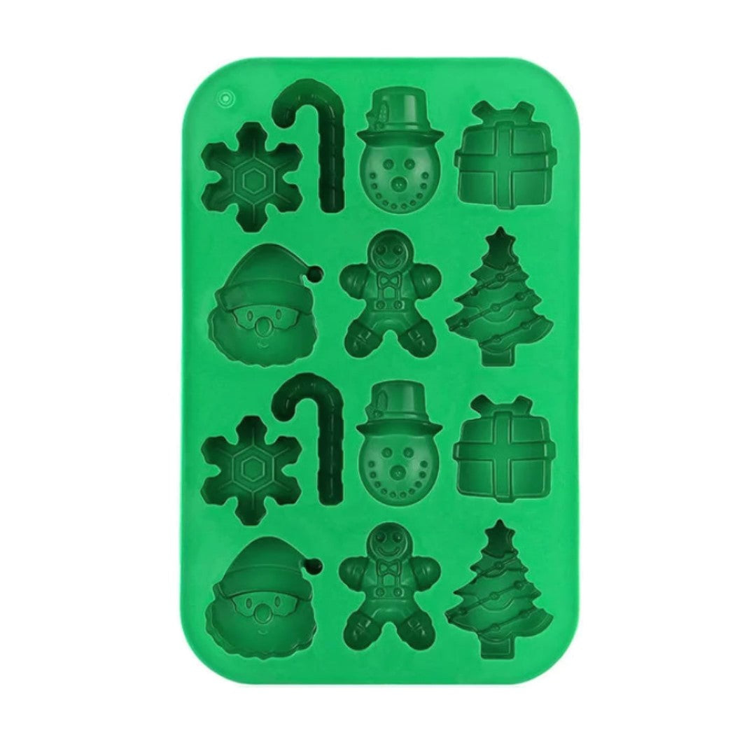 Green silicone mold with Christmas-themed shapes on a white background