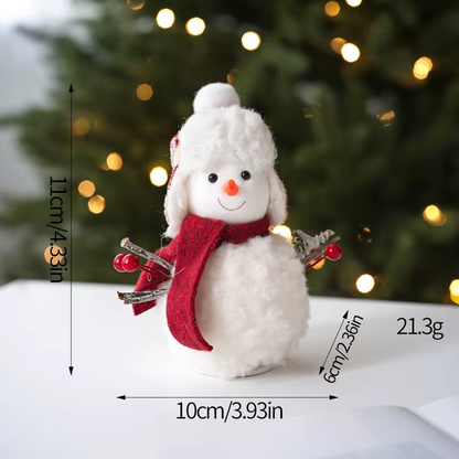 Small snowman figurine with measurements and a blurred Christmas tree background