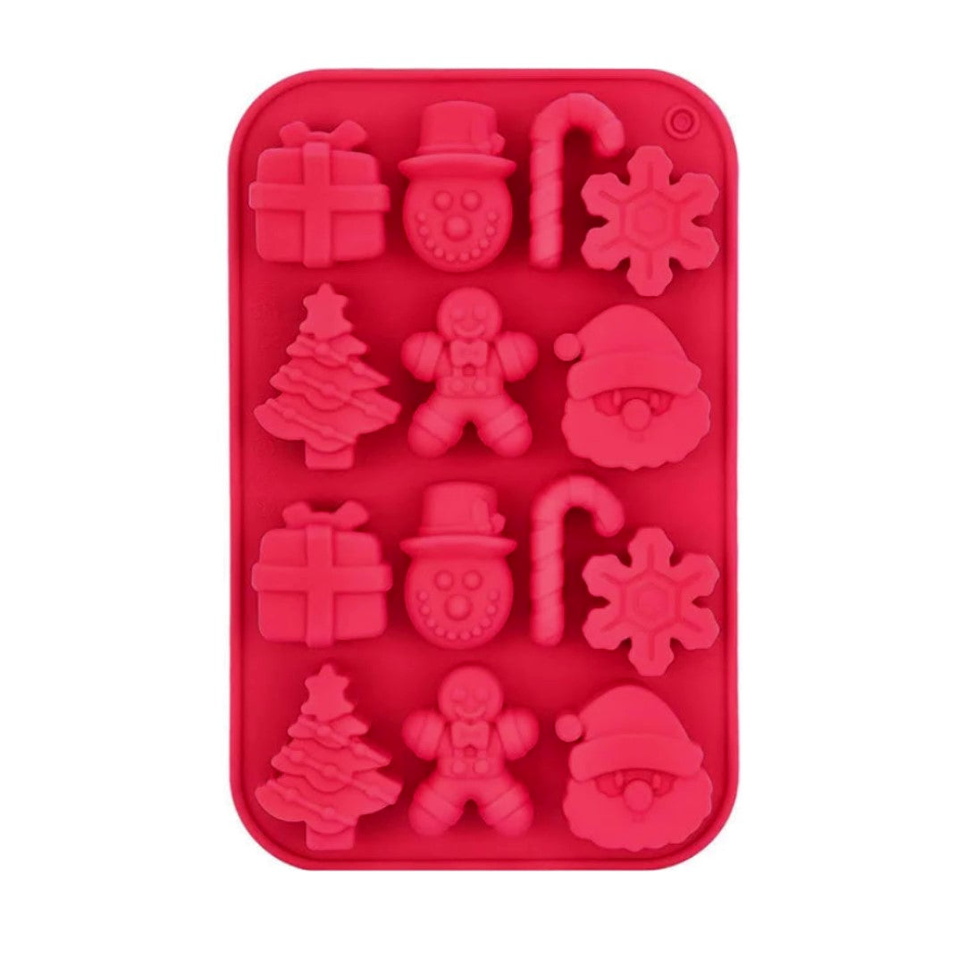 Red silicone mold with Christmas-themed shapes on a white background